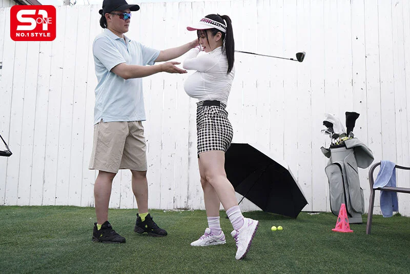 庭でゴルフの練習。